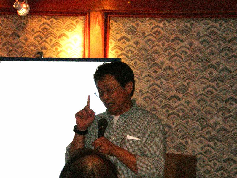 NEWS404_11.jpg - David makes concluding remarks & talks on feng shui for the new year